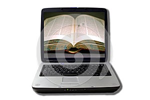 Laptop with open book on screen