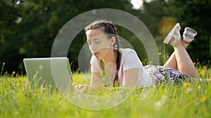 Laptop outdoor business technology. Student girl person work on tablet, computer in summer park. Online woman in nature