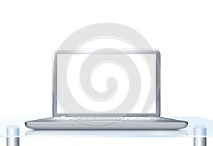 Laptop PC on glass table isolated