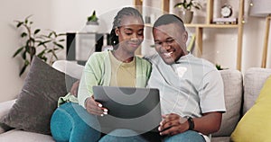 Laptop, pc movie and black couple smile on a living room sofa with love and happiness. Web series, internet and happy