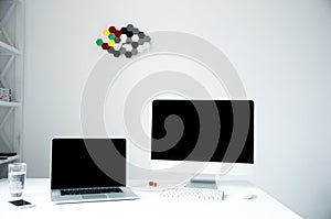 Laptop with PC on the table in office