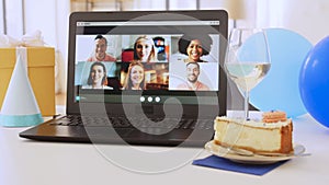 laptop with people having virtual birthday party