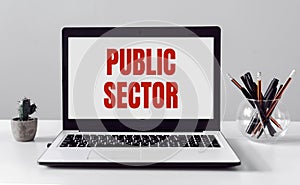 Laptop with Public Sector text on modern office background