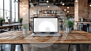 Laptop on rustic wooden table in modern cafe