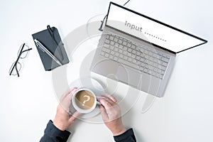 Laptop screen asking for input  and hands of an elderly woman are holding a coffee cup with a question mark reflection, white