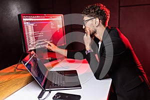 Laptop, screen and business man for coding, software development and programming script in cybersecurity