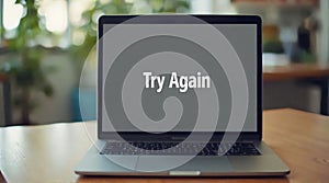 Laptop Screen Displaying Try Again Message in Bright Office