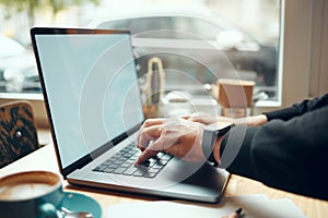 Laptop screen, mockup and hands in coffee shop for e learning, student online education and phd research. Computer mock