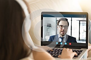 Laptop screen monitor view over woman shoulder, distant communication concept