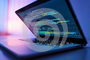 Laptop Screen Showing Programming Code at Night