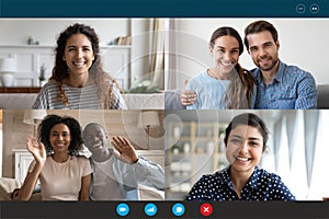 Laptop screen view four multiethnic families contacting distantly by videoconference