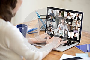 Laptop screen view diverse businesspeople involved at group videocall photo