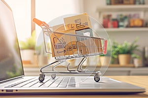 Laptop shopping miniature cart poised for online purchases