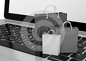 Laptop and shopping pags