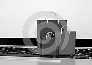 Laptop and shopping pags