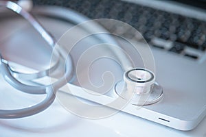 Laptop with stethoscope - a symbol of modern medicine and online healthcare solutions.