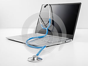 laptop and stethoscope on white background. online medicine  doctor online consultation. Healthy Hardware. Telemedicine concept.