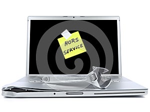 Laptop with sticky note and tool