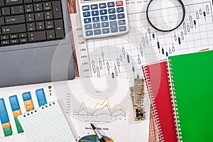 Laptop, stock market data, with calculator