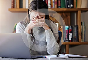 Laptop, stress and education with a student woman feeling burnout while studying alone in her home. Learning, headache