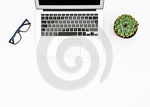 Laptop succulent plants glasses Office workplace Flat lay