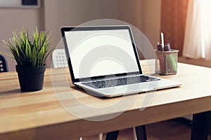 Laptop on table in the office room background, for graphics display montage.