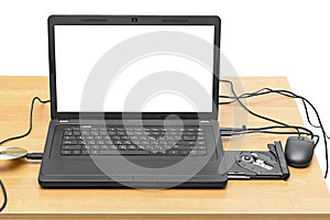 Laptop on a table with an open drive