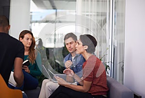 Laptop, tablet and business people in meeting in office for creative project planning and brainstorming. Discussion