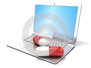 Laptop with two red pills. Concept of health care, diagnosis and repair of computers