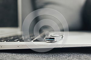 Laptop with a USB cable on it