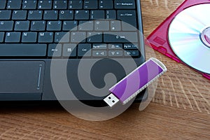 Laptop, USB drive and CD