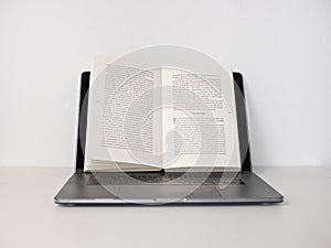 Laptop used as bookstand photo