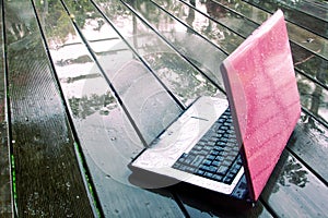 Laptop on wet floor