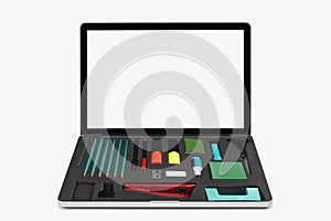 Laptop on white with office tools
