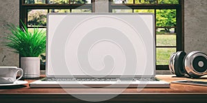 Laptop with white screen on wooden desk at home. Beautiful blurred nature background. 3d illustration