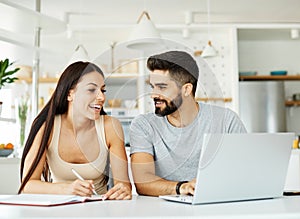 laptop woman man couple computer indoor technology young together lifestyle happy home love using