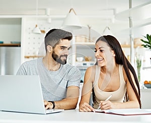 laptop woman man couple computer indoor technology young together lifestyle happy home love using