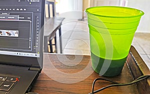 Laptop work at table with coffee cup in Mexico