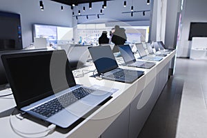 Laptops in a modern technology store. Department of computers in the electronics store. laptop in the store