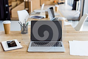 laptops and smartphone on tables