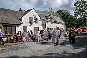 Laraugh,  Ireland - JULY 04,  2005: People dancing and drinking outside a famous pub in the Beautiful village of Lauragh situated