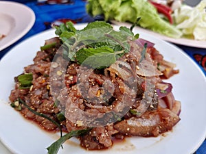 Larb Lu, a popular Isaan dish with blood and fresh pork.