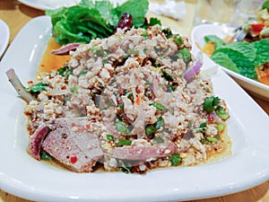 Larb Moo, Thai minced pork salad with herb. photo