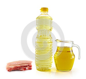 Lard oil in a plastic bottle and jar