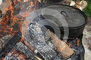 Large 16 Sixteen inch Lodge Camp Dutch Oven Sits in the Fire