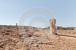 Large abstract figure carved from stone in a public sculpture park in the desert, on a cliff above the Judean Desert near Mitzpe