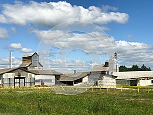 Large agricultural agricultural farm building with equipment, houses, barns, granary