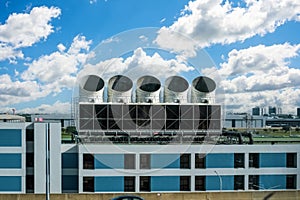 Large air intakes building ventilation conditioning system of a large industrial building. photo