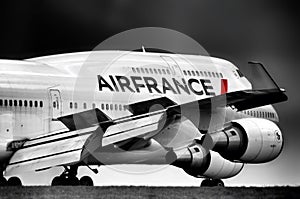 Large airplane  after landing. Close up of the wing and engines and front fuselage. Air France Boeing 747. 05/06/2012 - Paris,