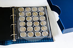 Large album for collectible coins in capsules